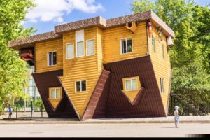 upside down house, symbolising a house with non-standard construction.