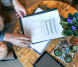 Top view of man ready to sign a document